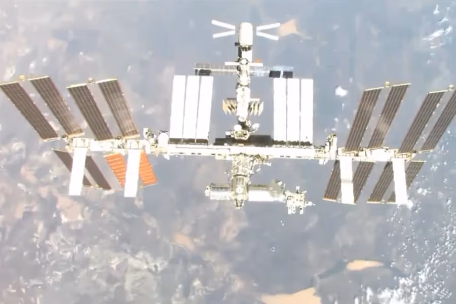 Satellite floating in space above earth.