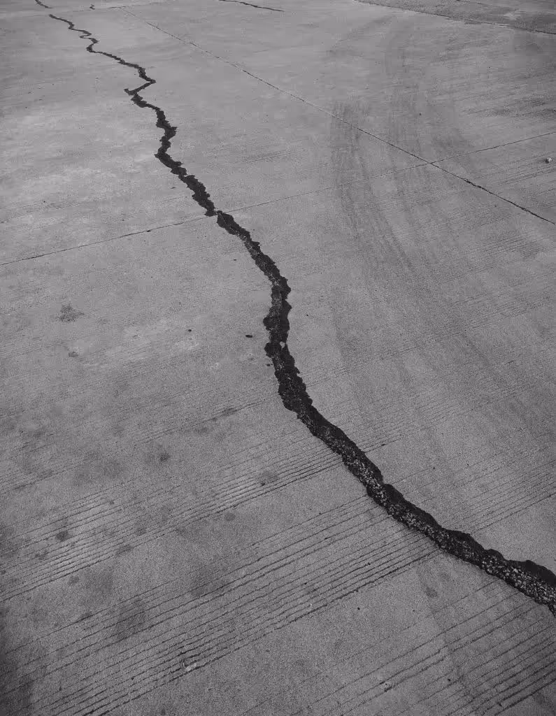 Large crack in concrete flooring.