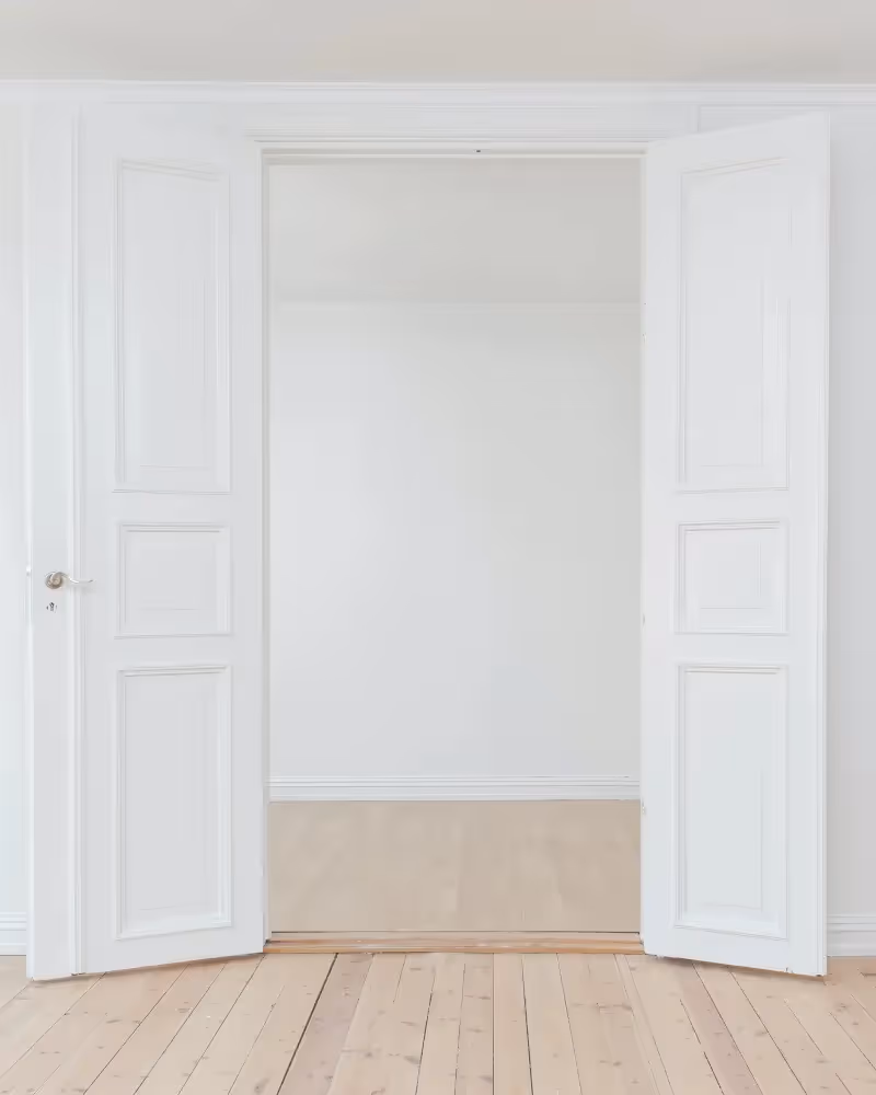 White room with open double doors.