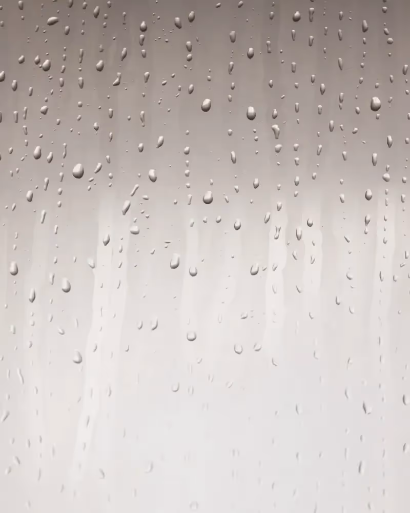 Glass with raindrops on it.