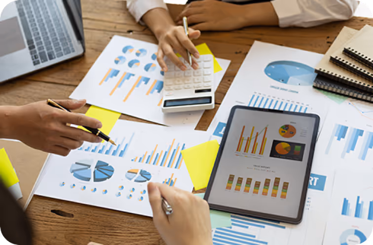 Team analyzing charts, graphs, and business data
