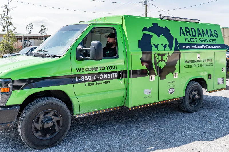 Green Ardamas Fleet Services truck for mobile maintenance and repair with contact number on the side.