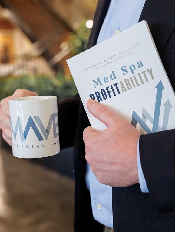 MedSpa professionals reading “Med Spa Profitability” book, supported by expert guidance from an Aesthetic Medicine Fractional CFO Richardson