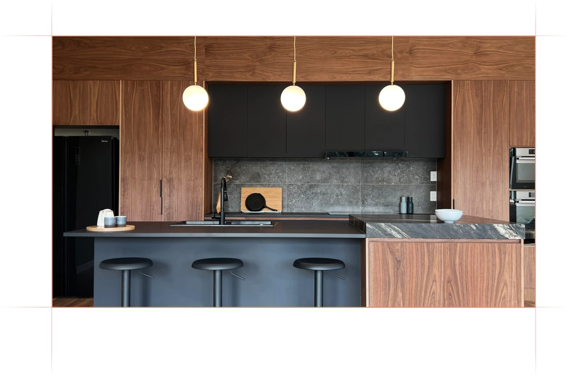 Kitchen with wooden styling, black accents and pendant lights