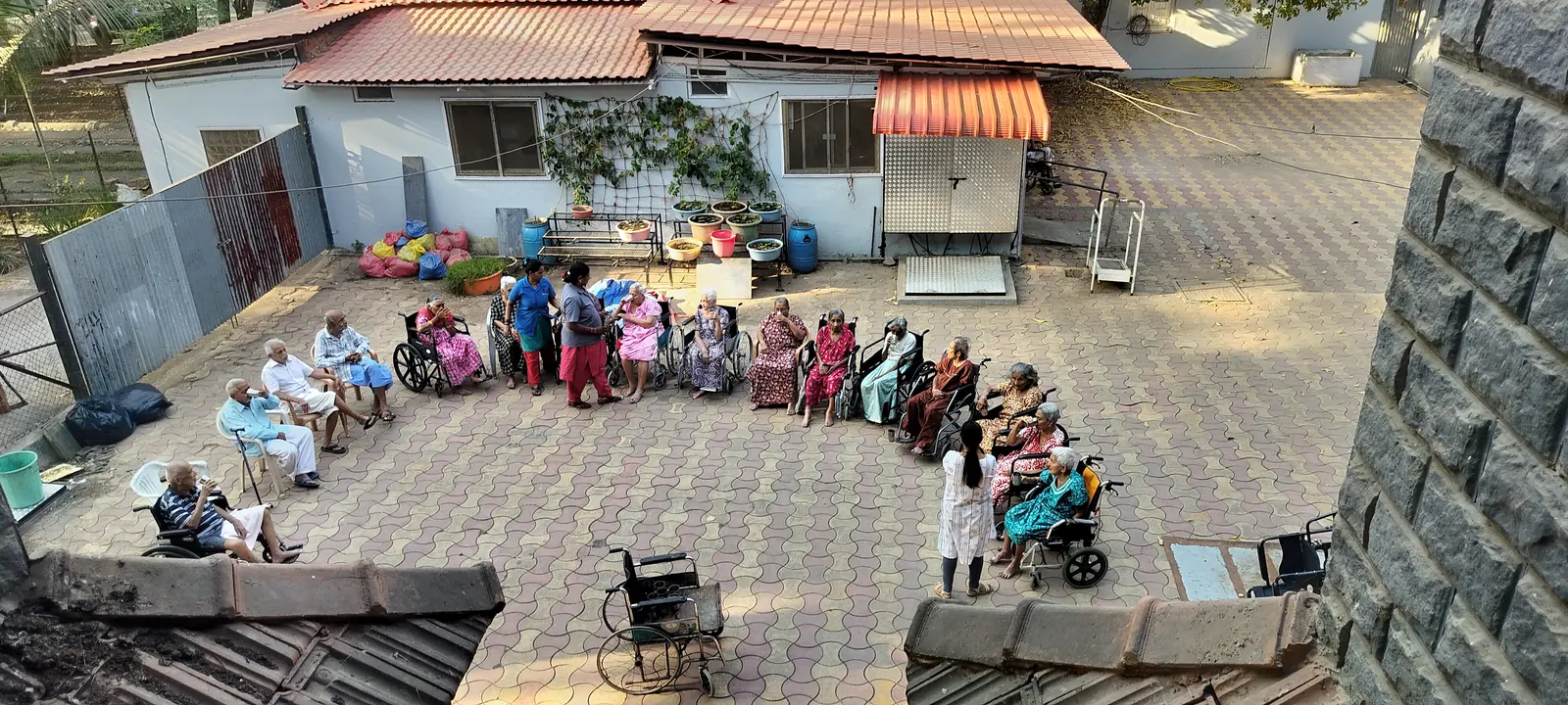 Residents and staff celebrating together in the courtyard