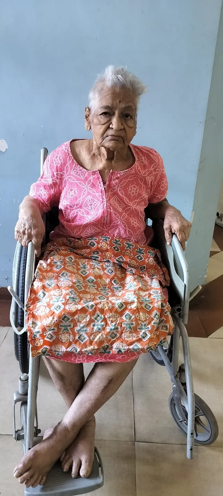 Caregiver attending warmly to a resident — the breadth of care