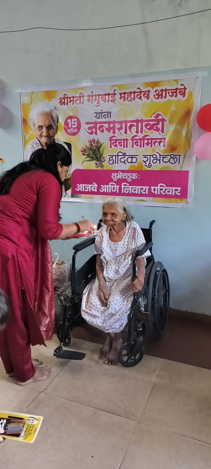 Caregiver attending warmly to a resident — the breadth of care