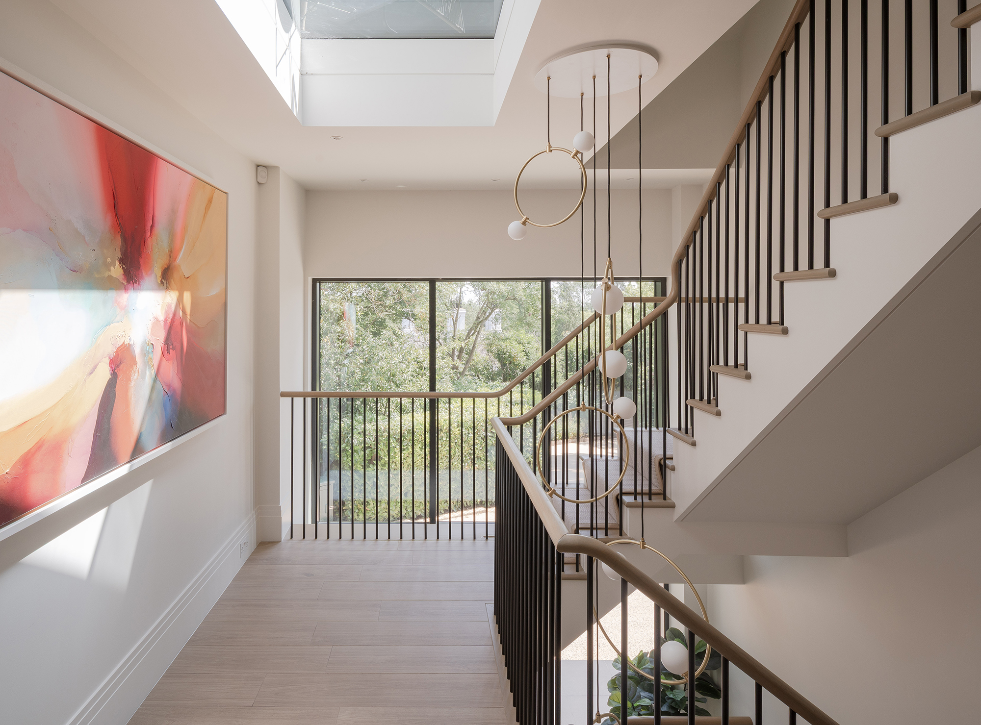 Feature staircase across 3 floors with huge picture window in crittal style and roof lantern