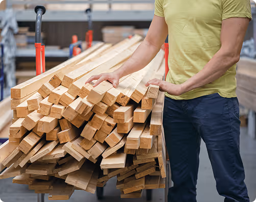 Person typing on a laptop to manage retail freight logistics