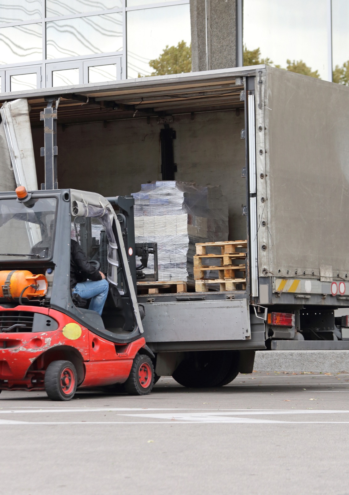 Forklift loading pallets into a truck