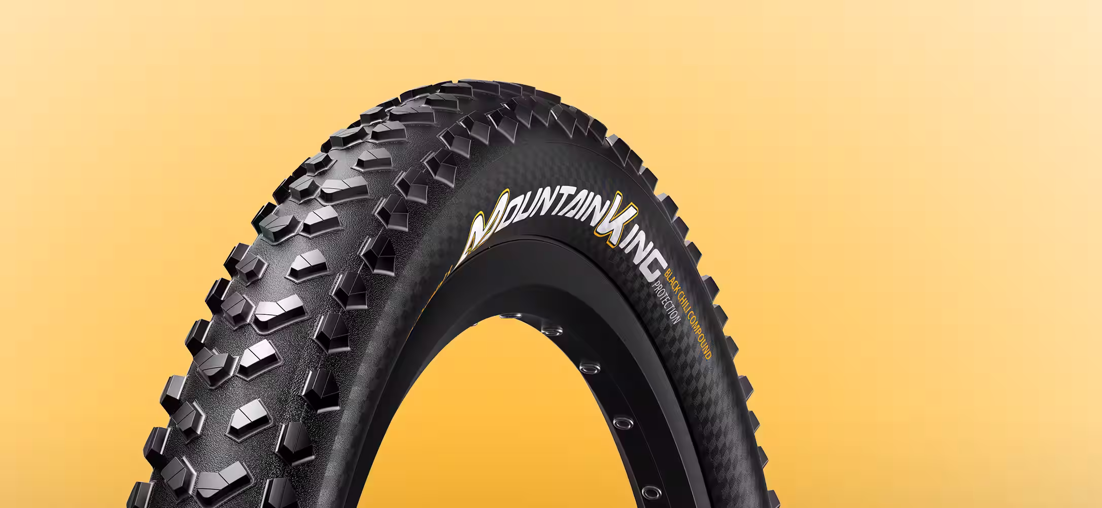 Produktdesign Beispiel - Continental Mountain King Fahrradreifen mit detailliertem Profildesign auf gelbem Hintergrund