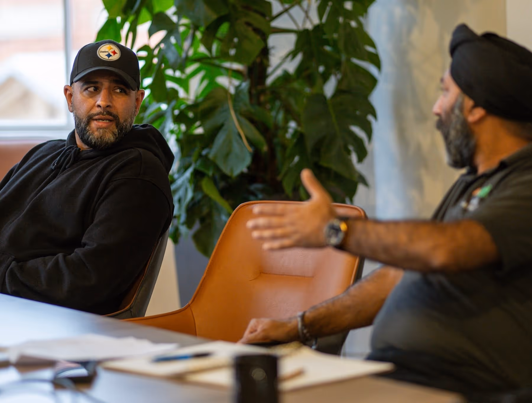 Two men talking at a table