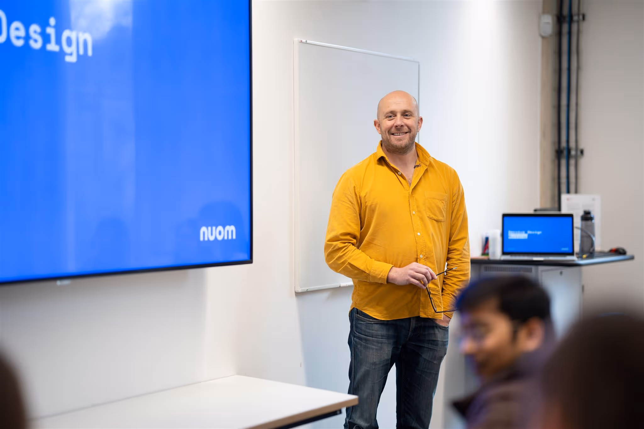 Man giving a talk to a group of people