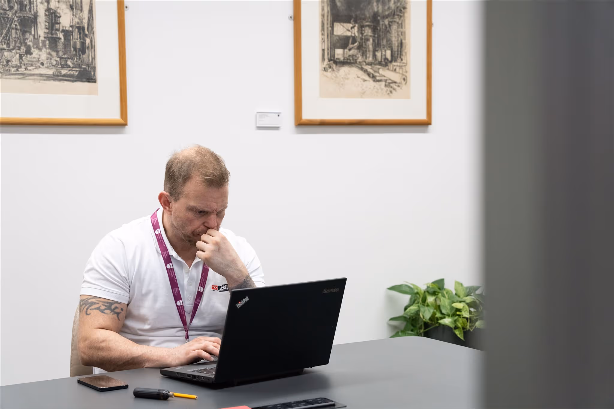 Man writing on a whiteboard wall