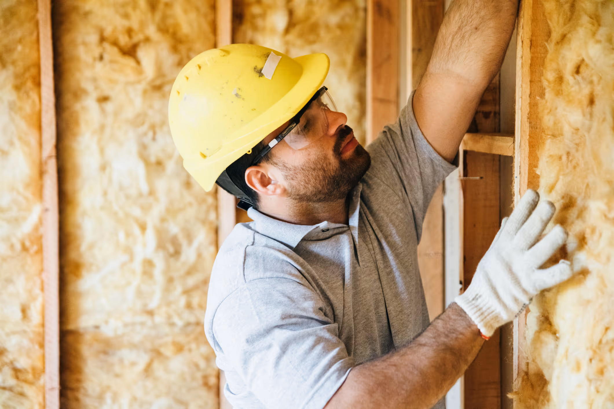 Contractor installing home insulation
