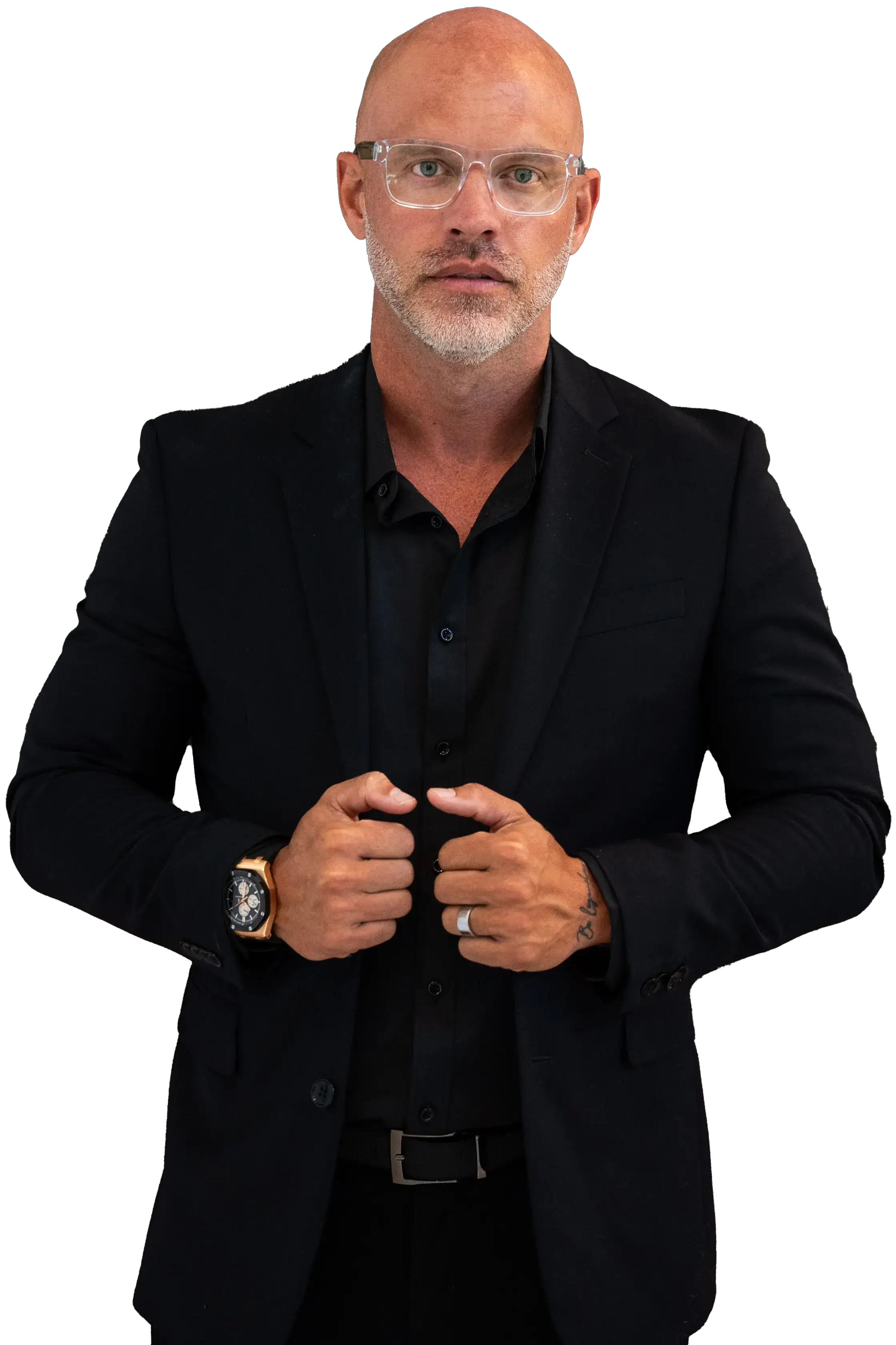 Josh Galindo headshot, wearing an all black suit and glasses.