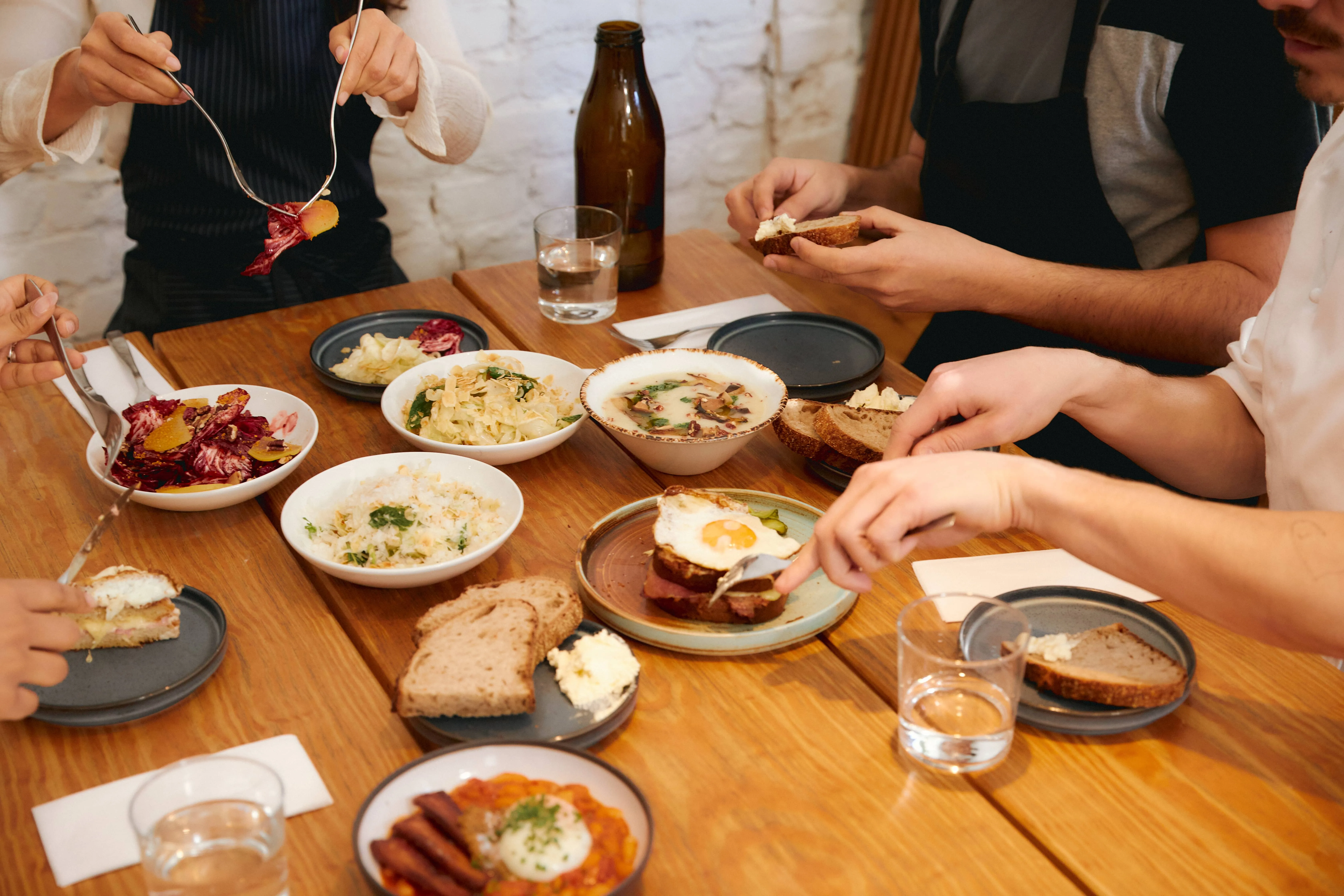 A restaurant table filled with food