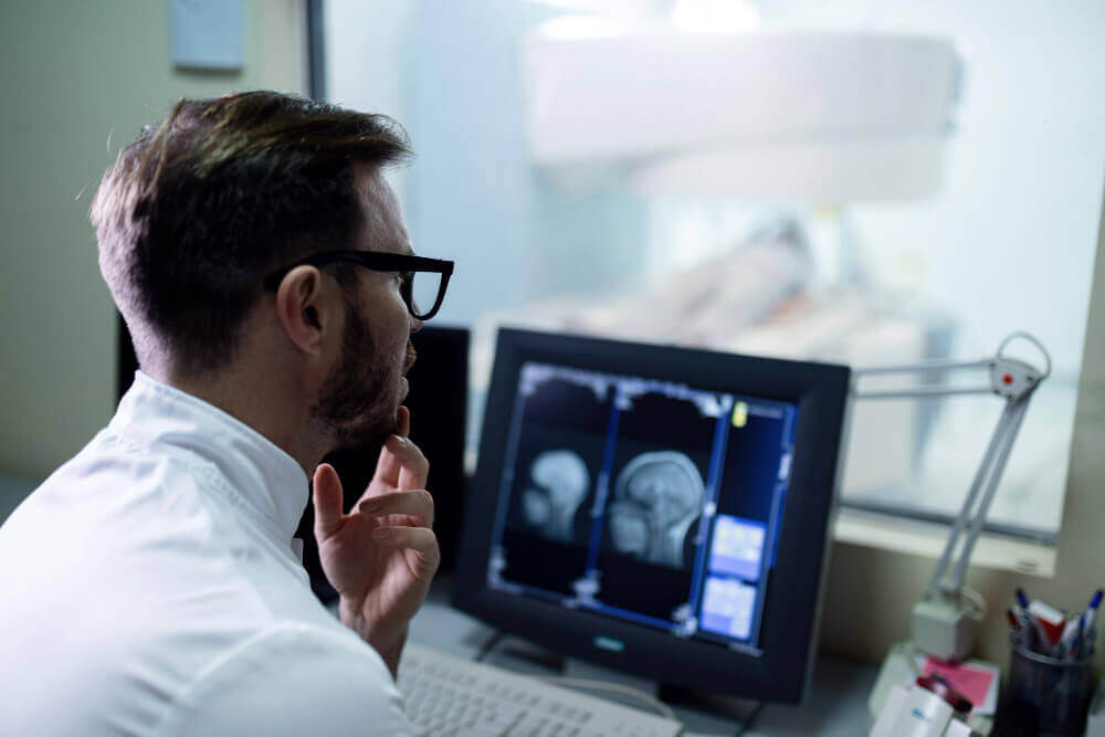 doctor examining mri scan results 