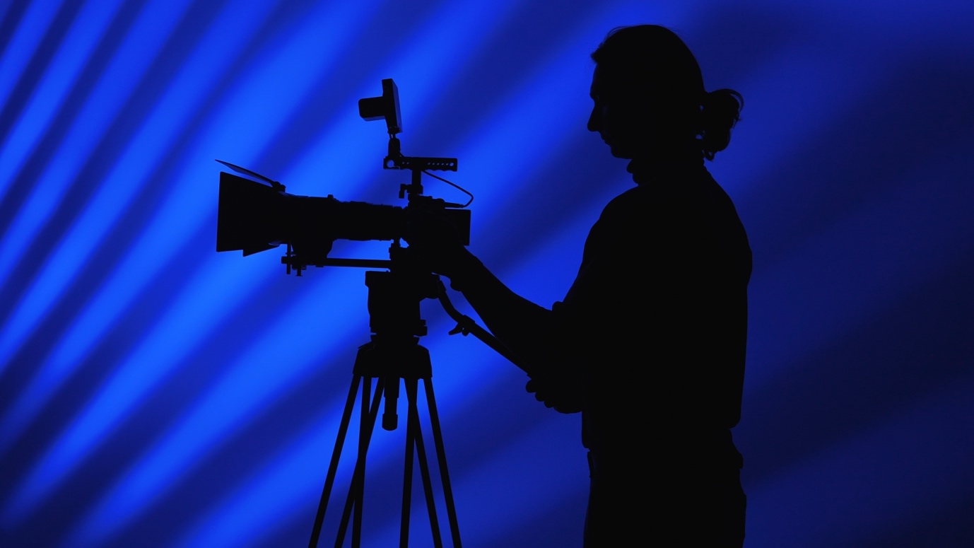 A silhouette of a person using a cameraAI-generated content may be incorrect.