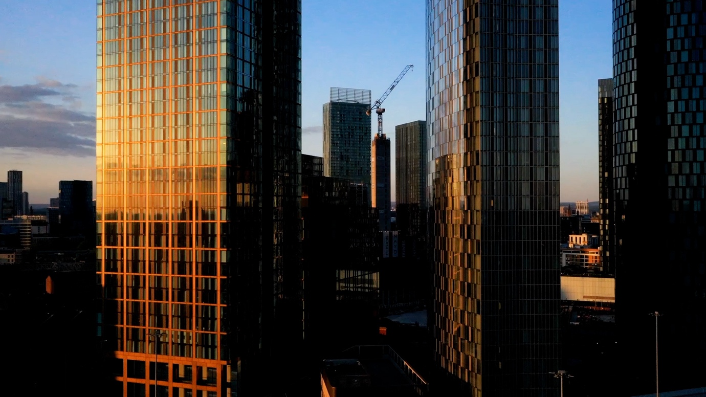 A low angle view of tall buildingsAI-generated content may be incorrect.