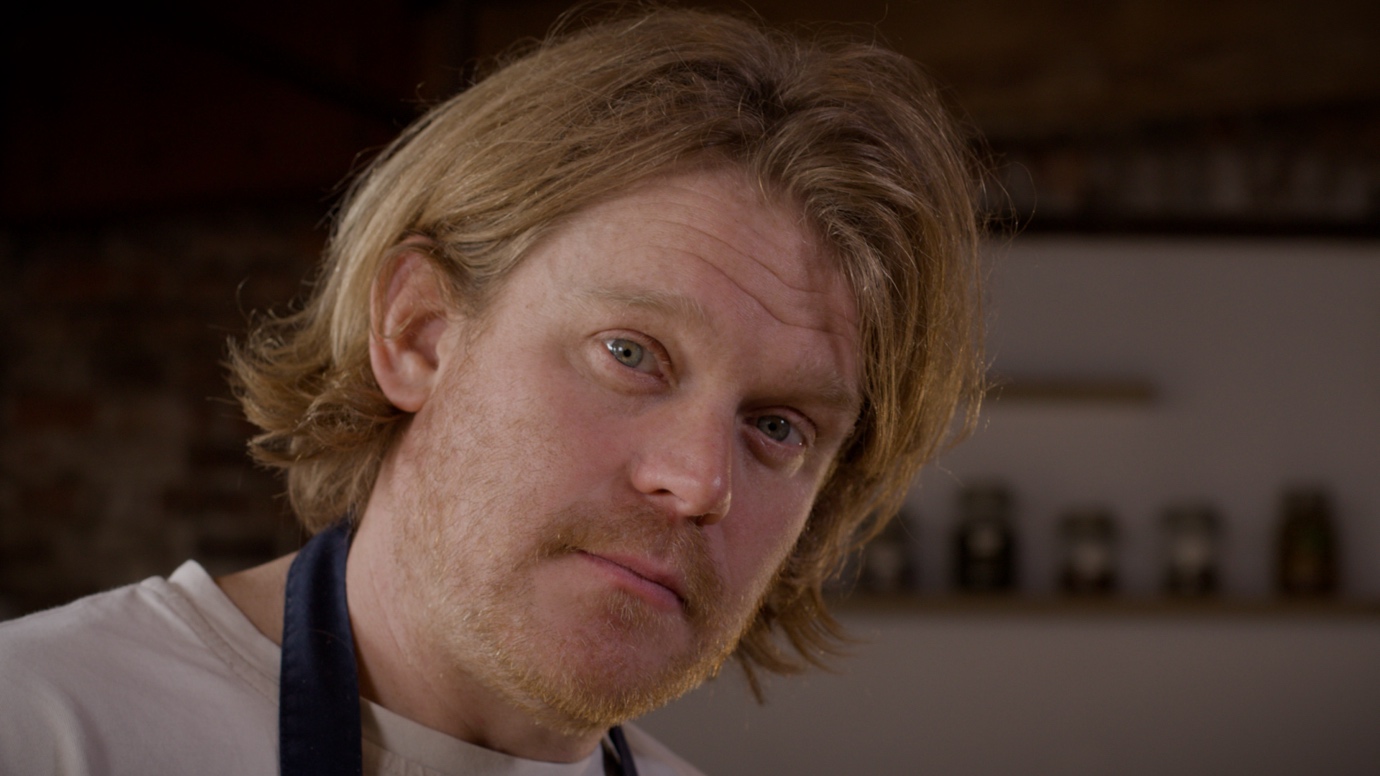 A person with a mustache and a beardAI-generated content may be incorrect.