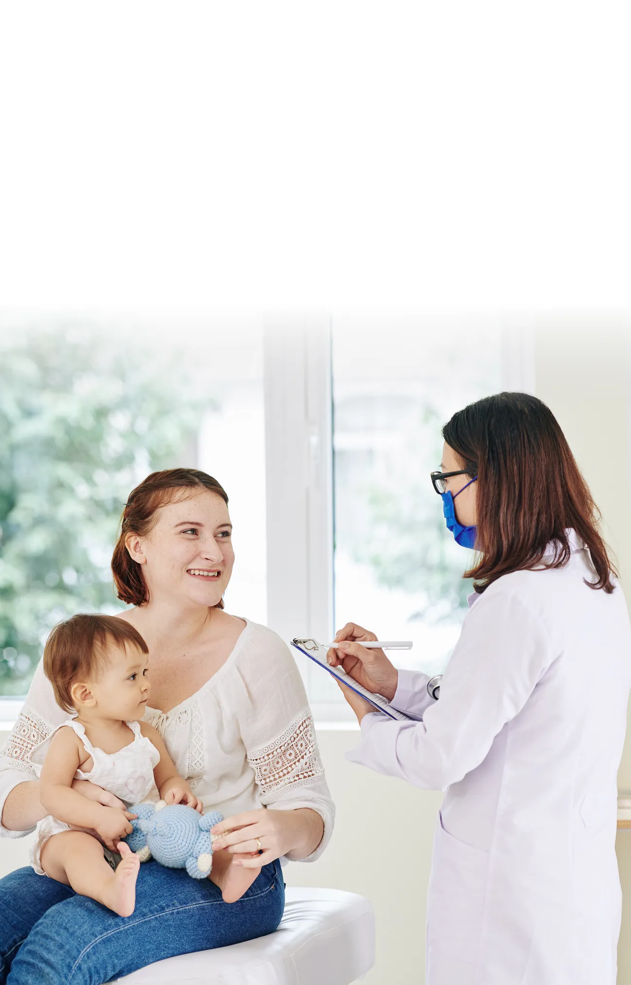 Baby with its mother and pediatrician