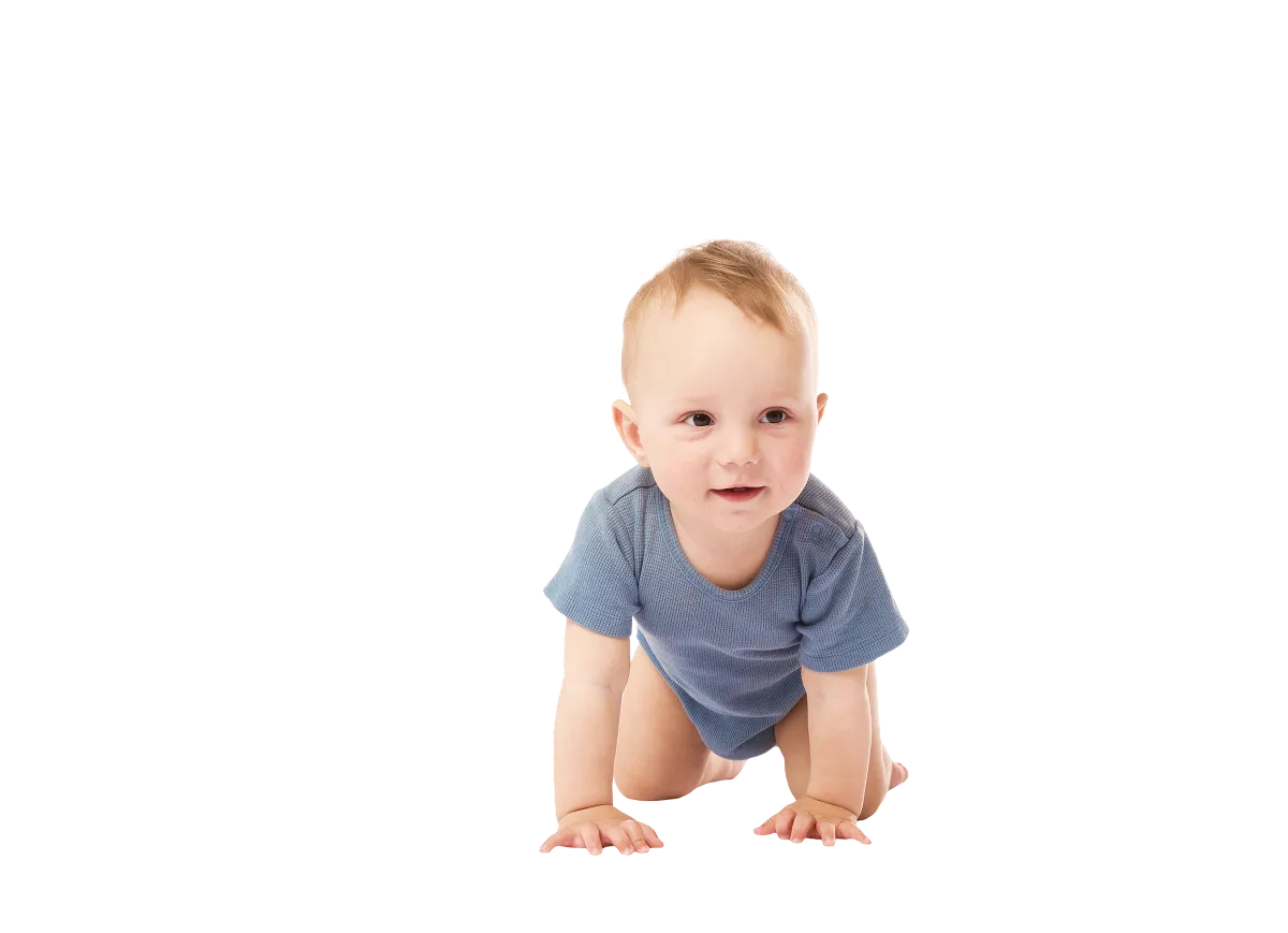 A baby in a blue onesie crawling and looking ahead.