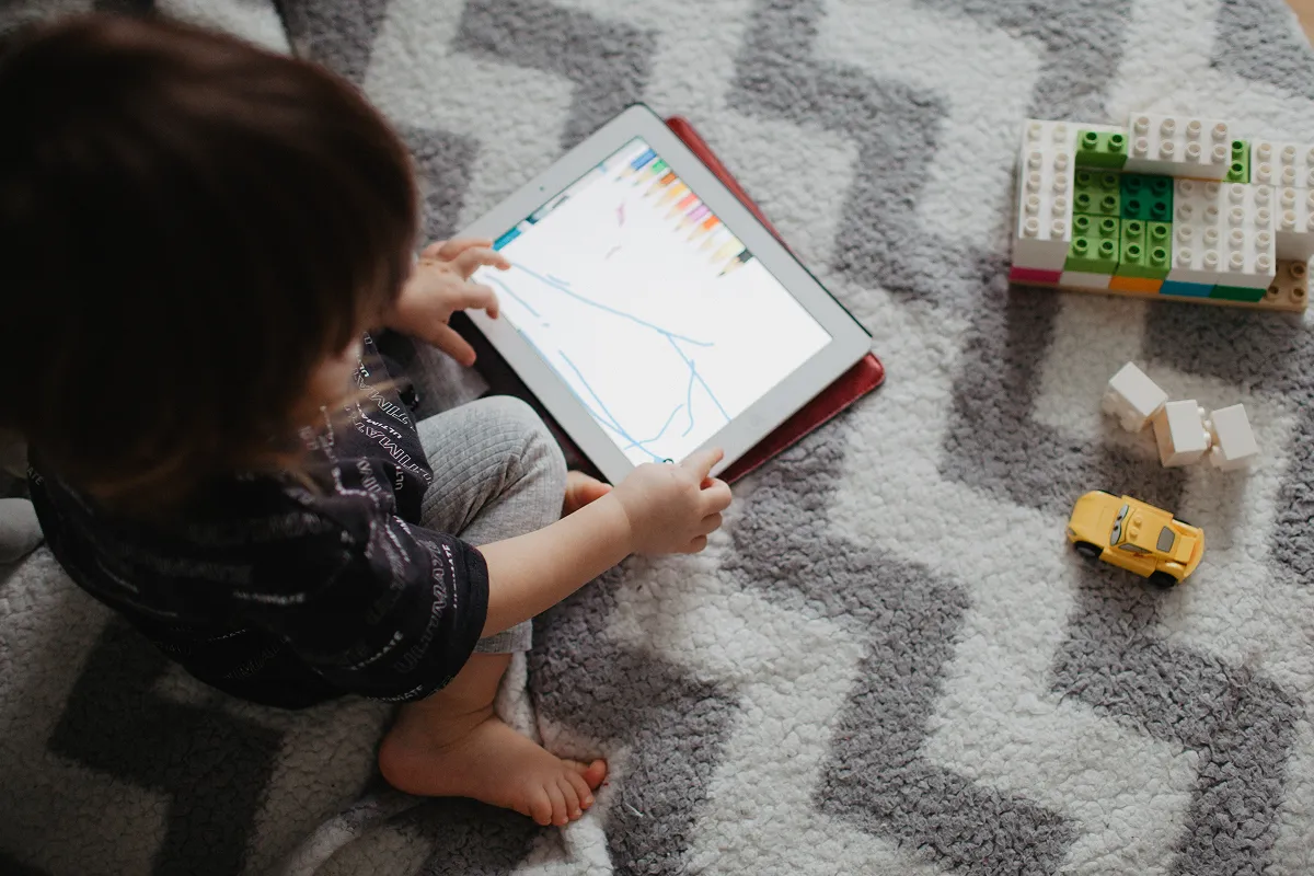 Child playing on an iPad