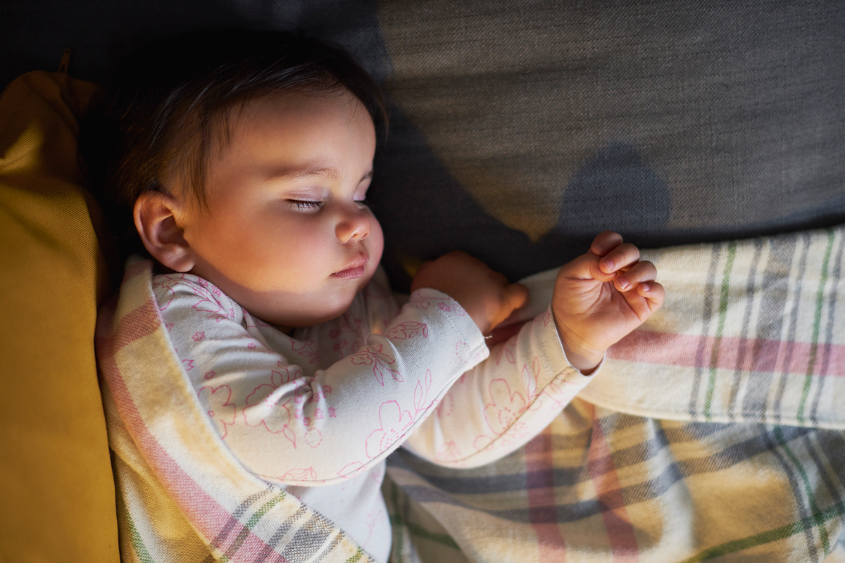 Baby sleeping in bed at night