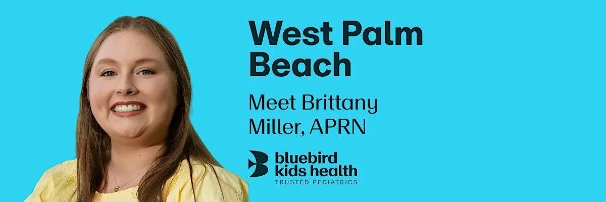 Expectant couple embracing and smiling on a Bluebird Kids Health event banner for the West Palm Beach practice