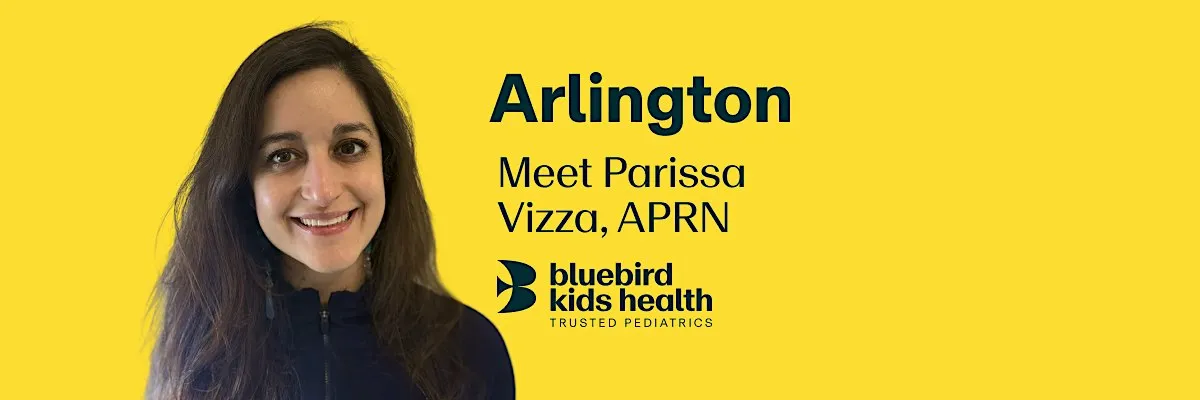 Expectant couple embracing and smiling on a Bluebird Kids Health event banner