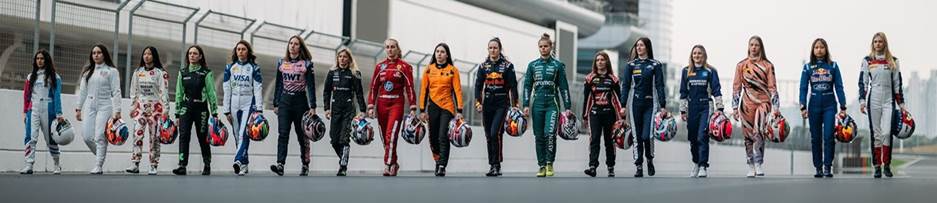 A group of people in racing suitsAI-generated content may be incorrect.