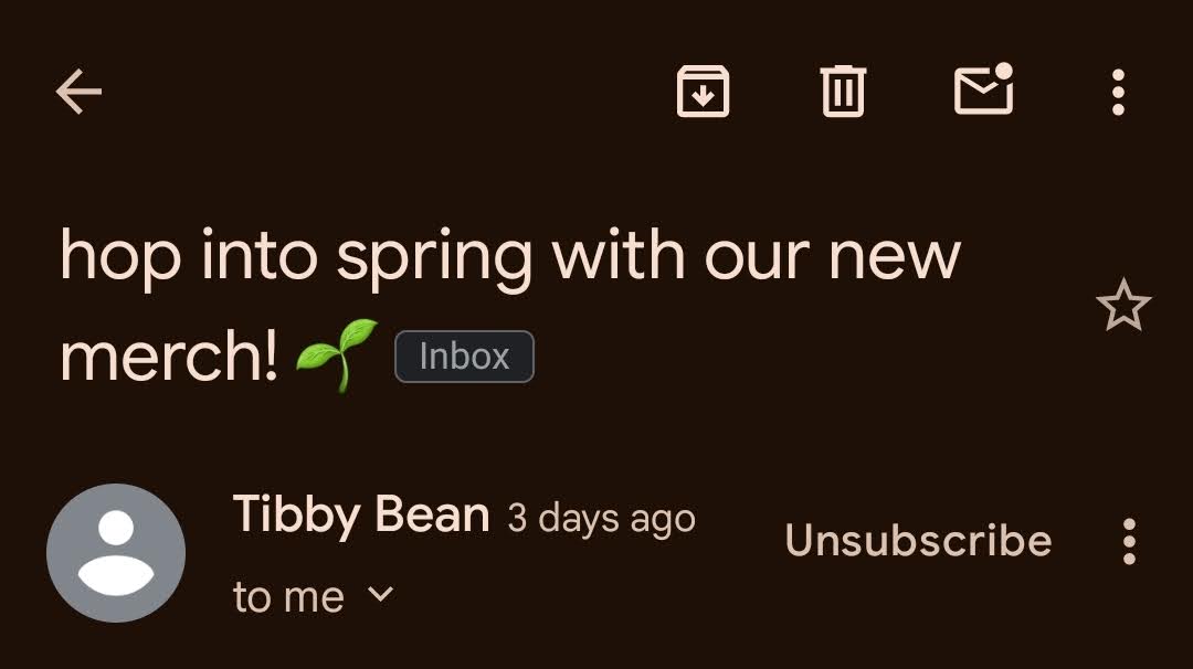 The mobile Gmail app. The drop-down menu is next to the unsubscribe button. The email advertises handmade frog-themed art from Tibby Bean.