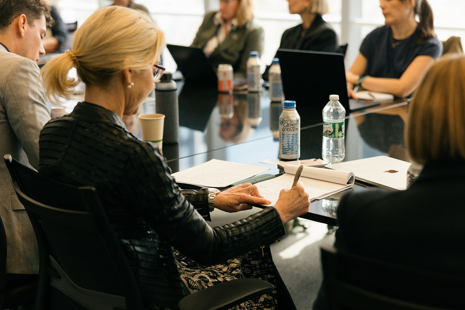 Woman writing notes at meeting at Port Powerhouse Climate Week 2026