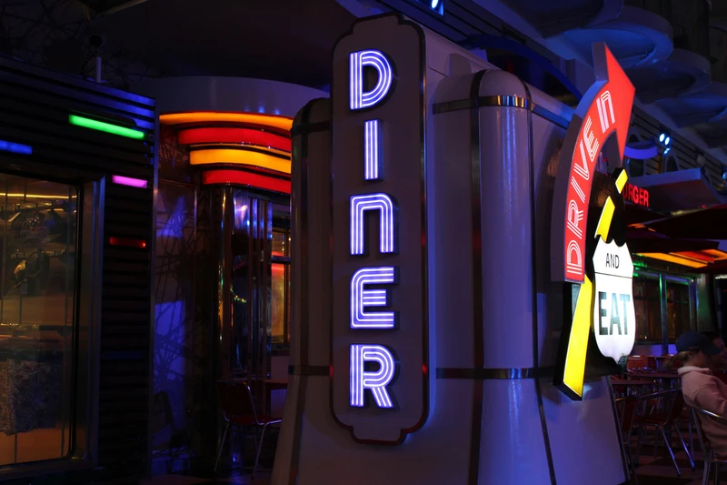 neon sign that says diner