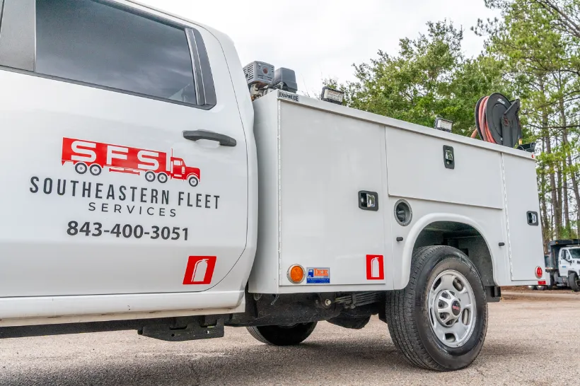 Regional repair shop service truck with utility body, displaying SFS Southeastern Fleet Services and phone number 843-400-3051.