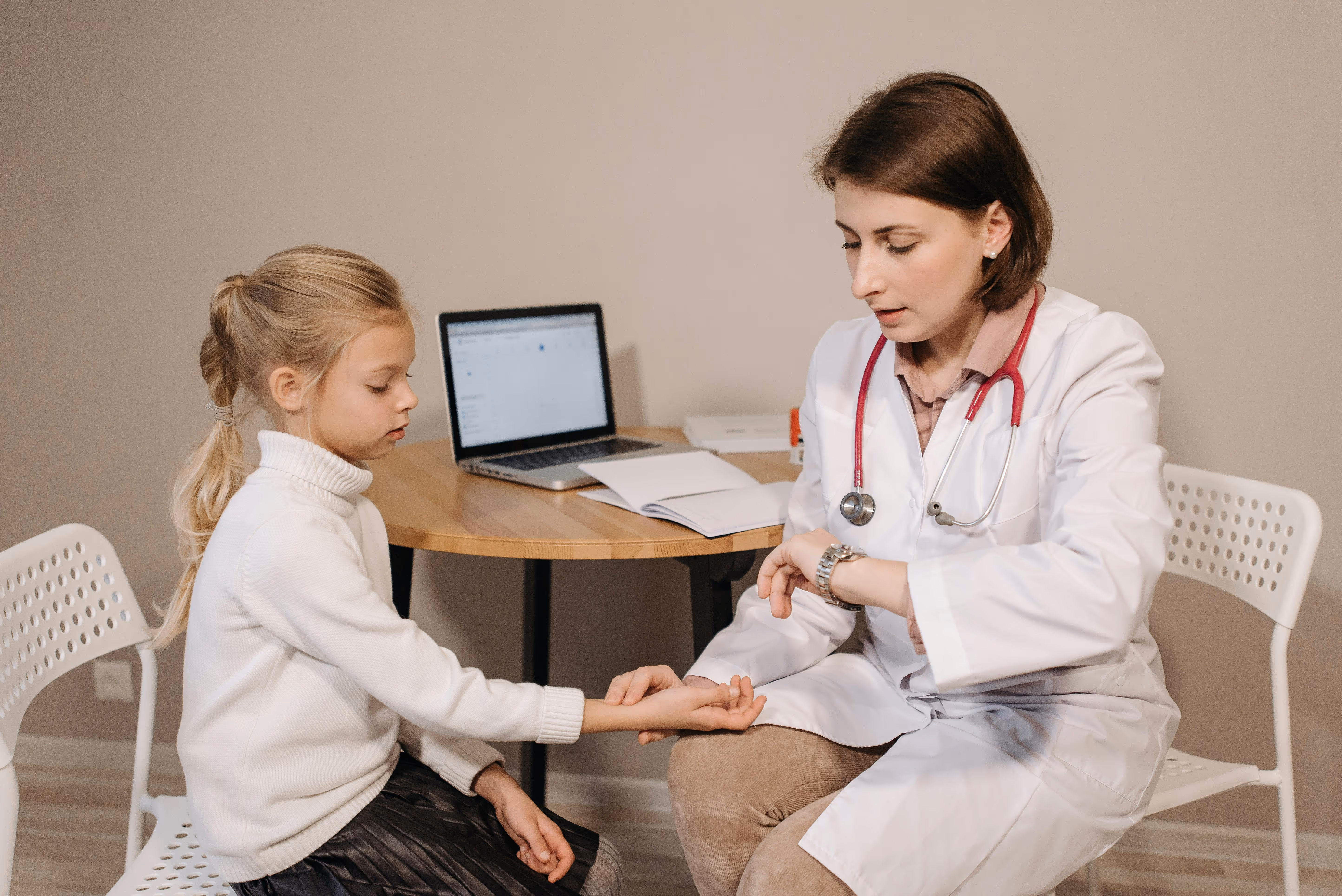 Child at dermatologist for treatment of hair disorder. 