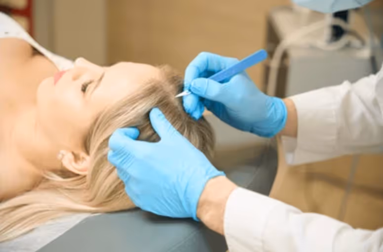 Provider applying cryotherapy to a skin tag.