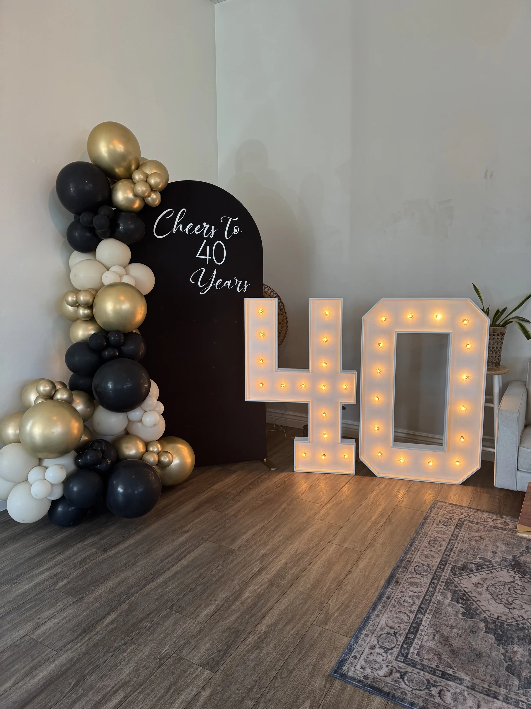 Black and gold 40th birthday by Poptastic Parties