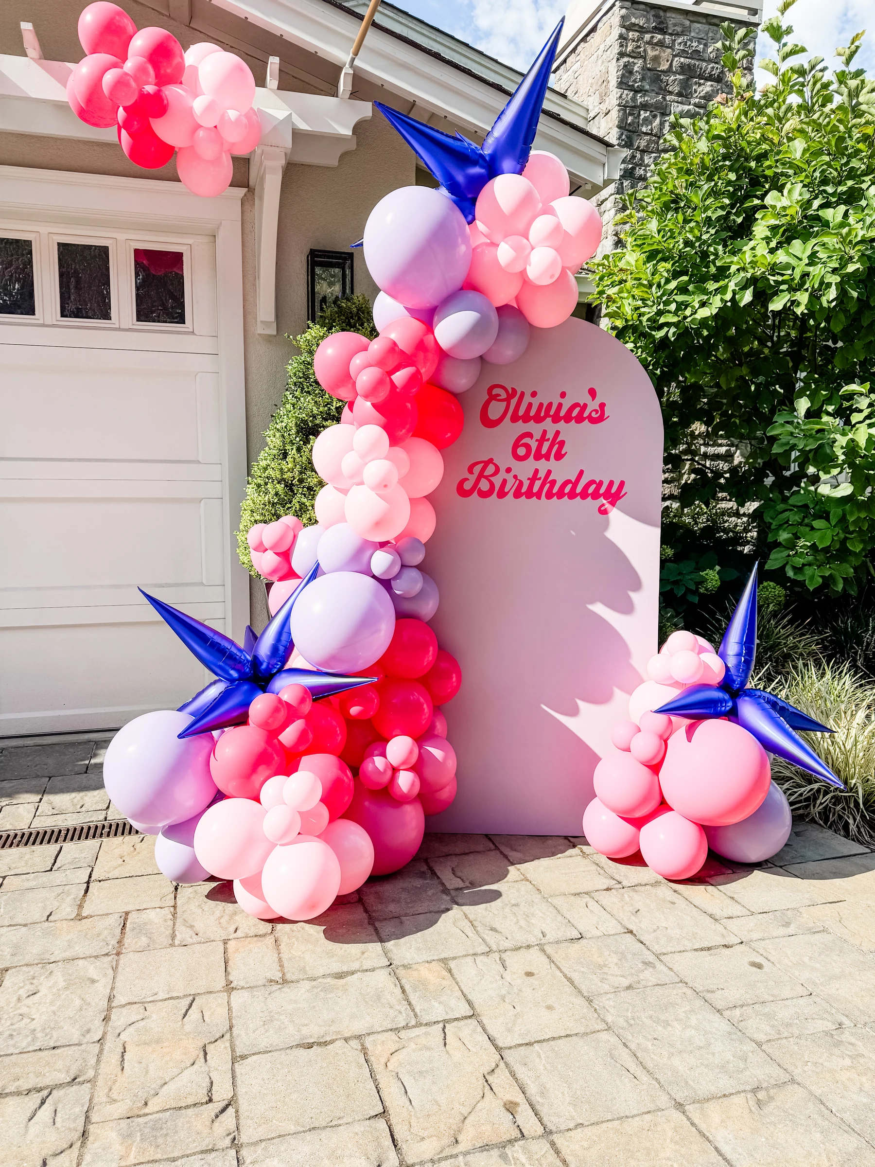 Pink and purple birthday backdrop by Poptastic Parties