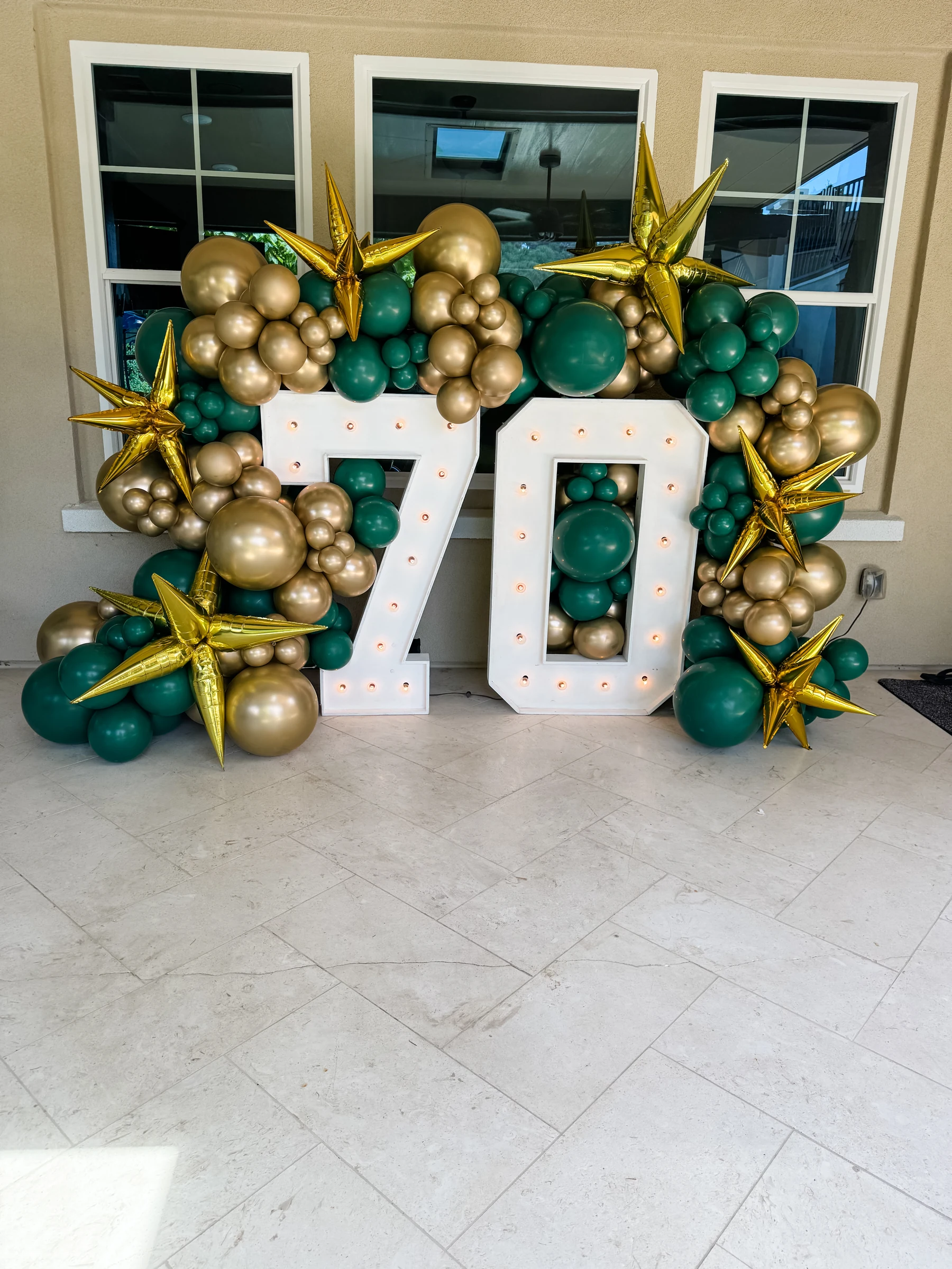 Green and gold 70th birthday by Poptastic Parties