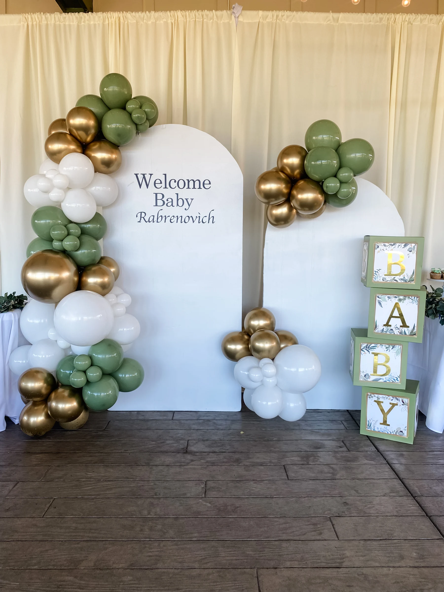 Sage and gold welcome-baby backdrop by Poptastic Parties