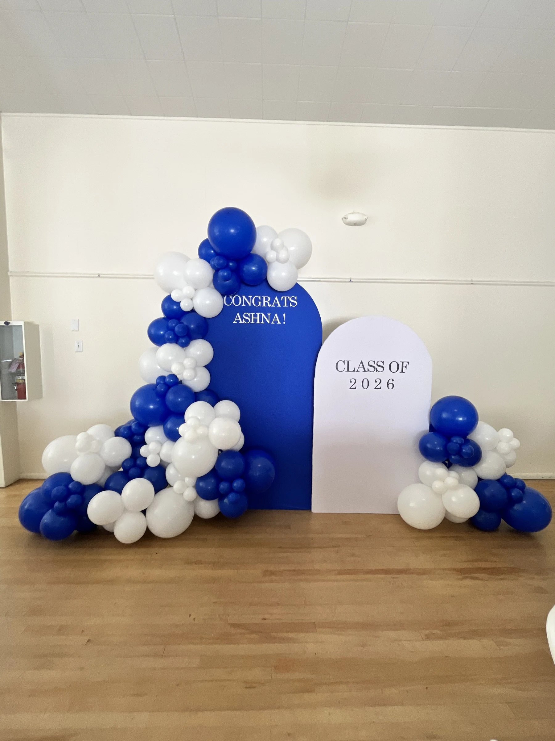 Blue and white Class of 2026 by Poptastic Parties