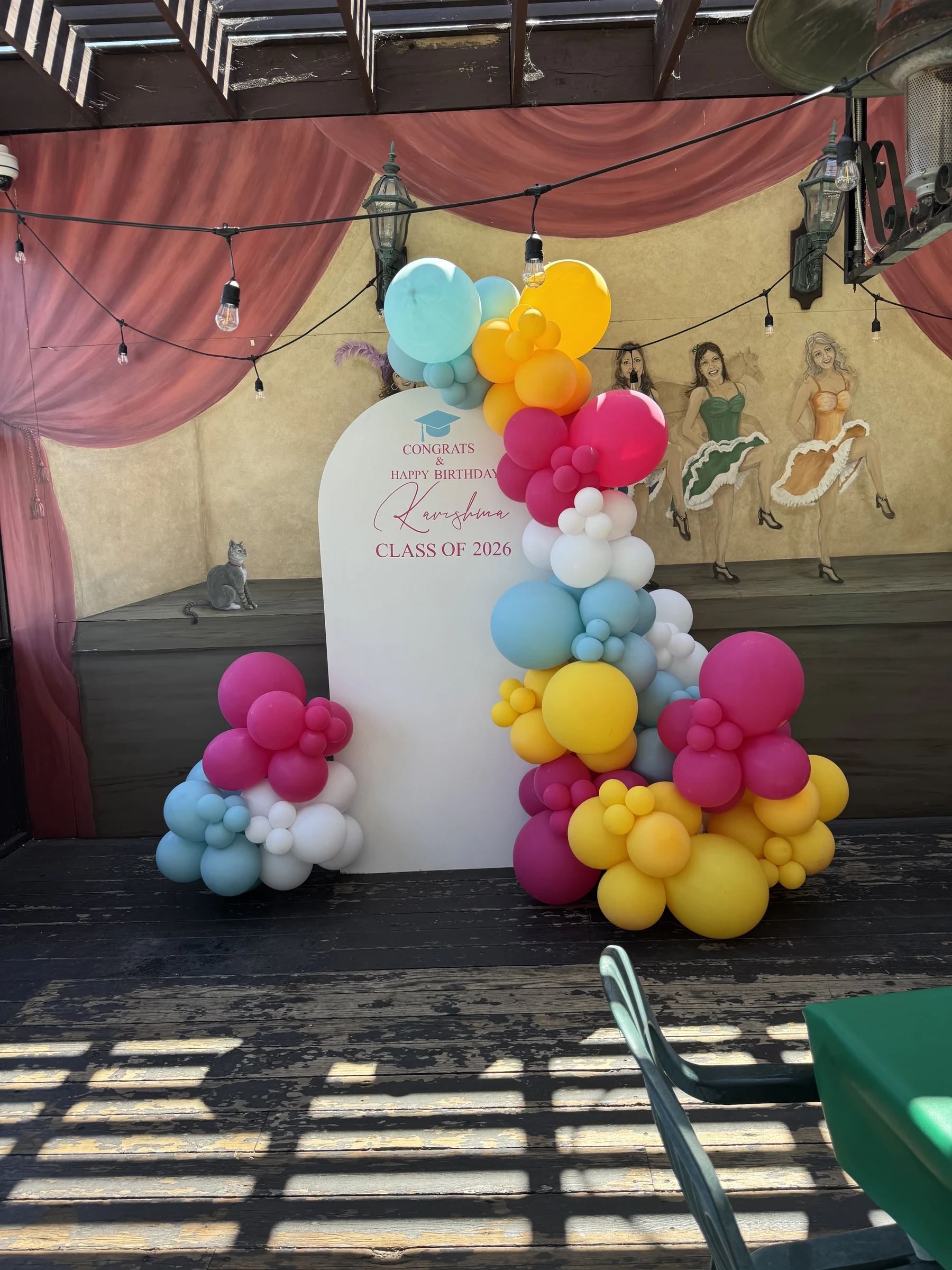 Colorful floral graduation backdrop by Poptastic Parties