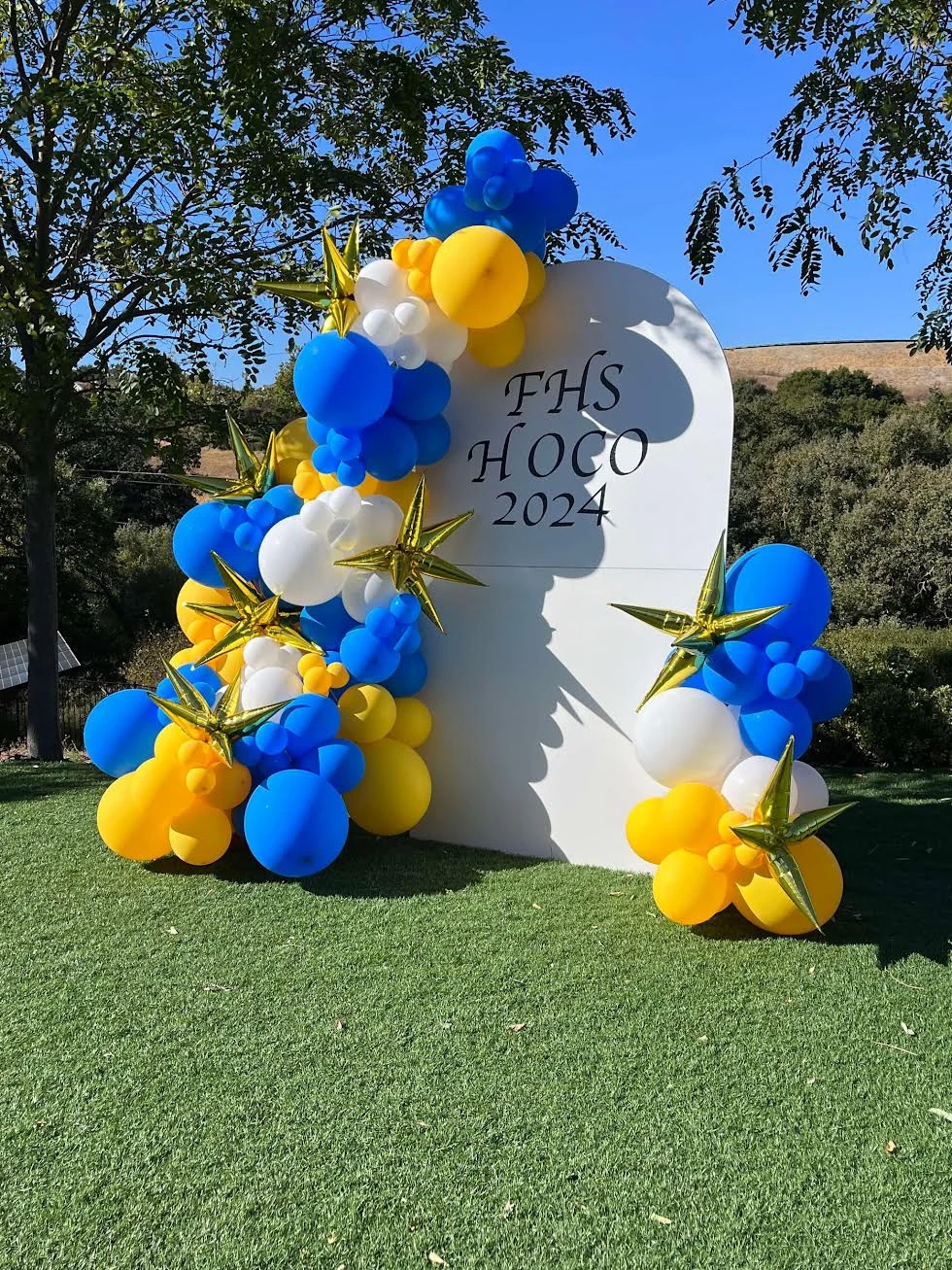 Blue and gold homecoming backdrop by Poptastic Parties