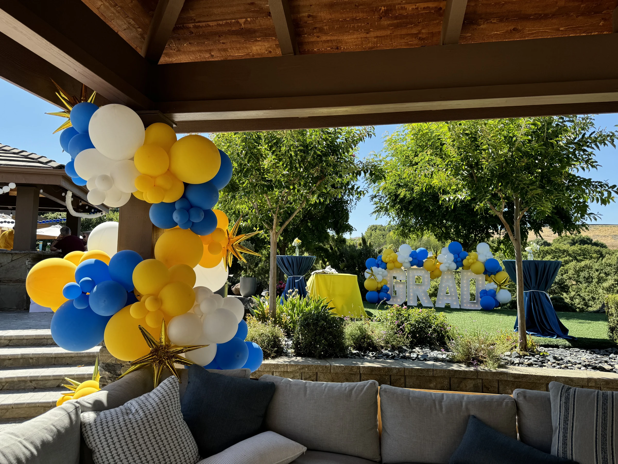 Graduation garden and patio view by Poptastic Parties