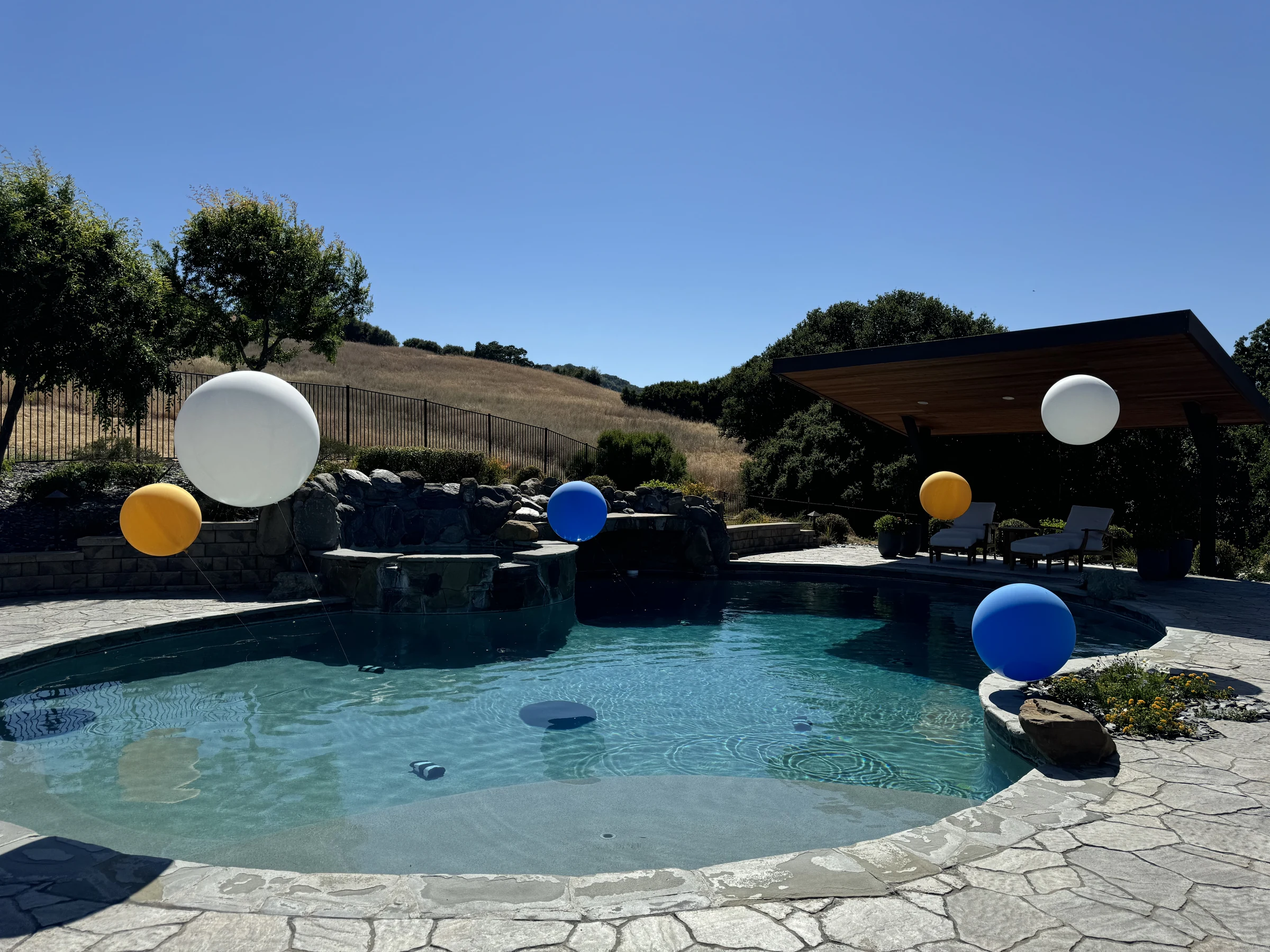 Graduation pool and patio decorations by Poptastic Parties