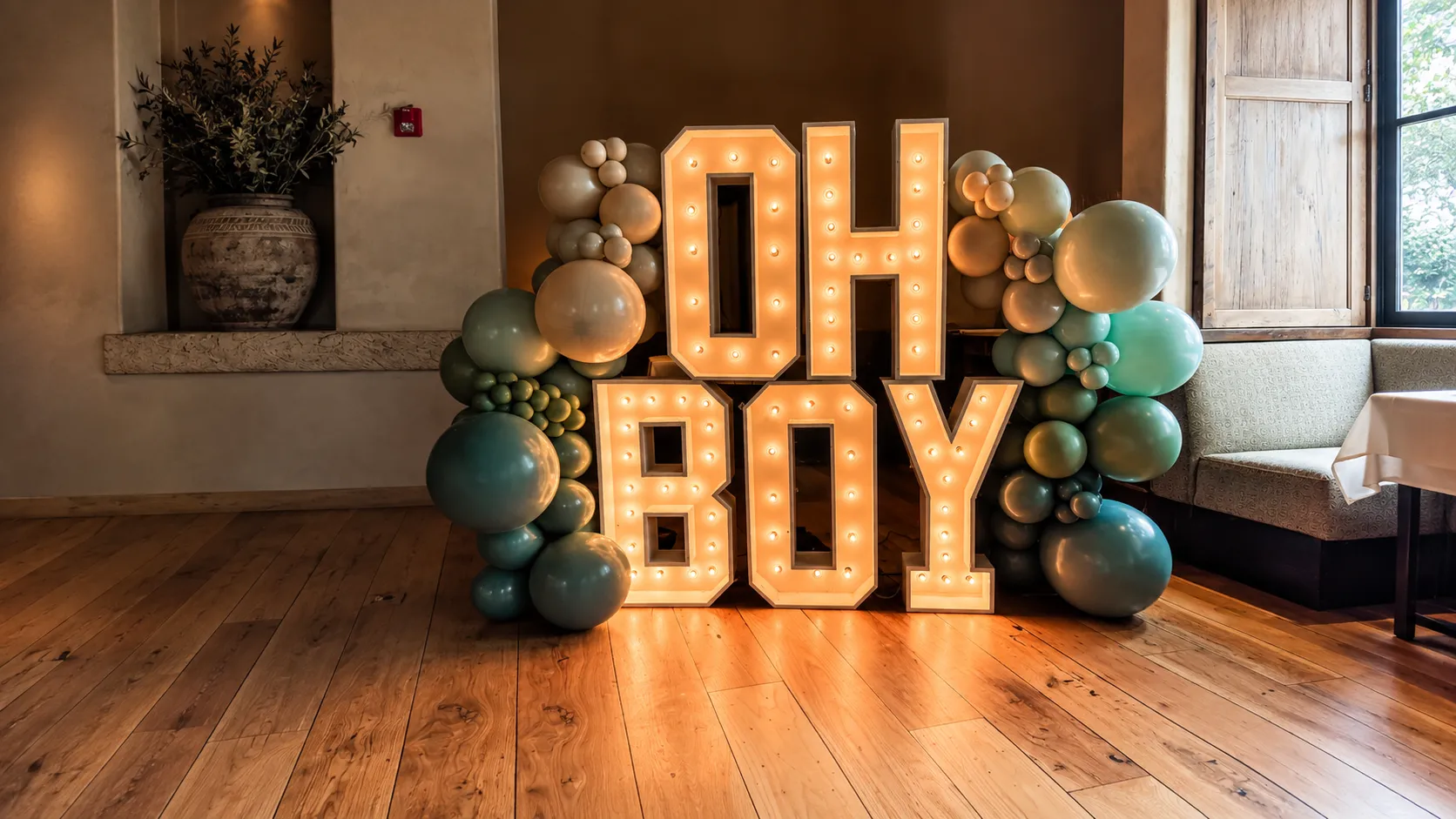 Illuminated OH BOY letters with teal and neutral baby shower balloons by Poptastic Parties