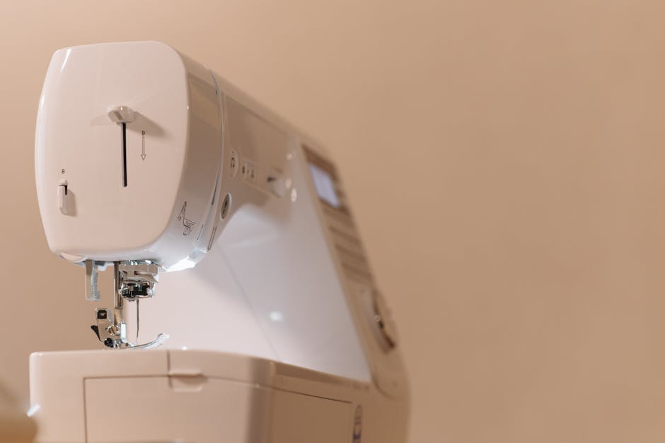 Detailed close-up of a modern sewing machine used in tailoring.