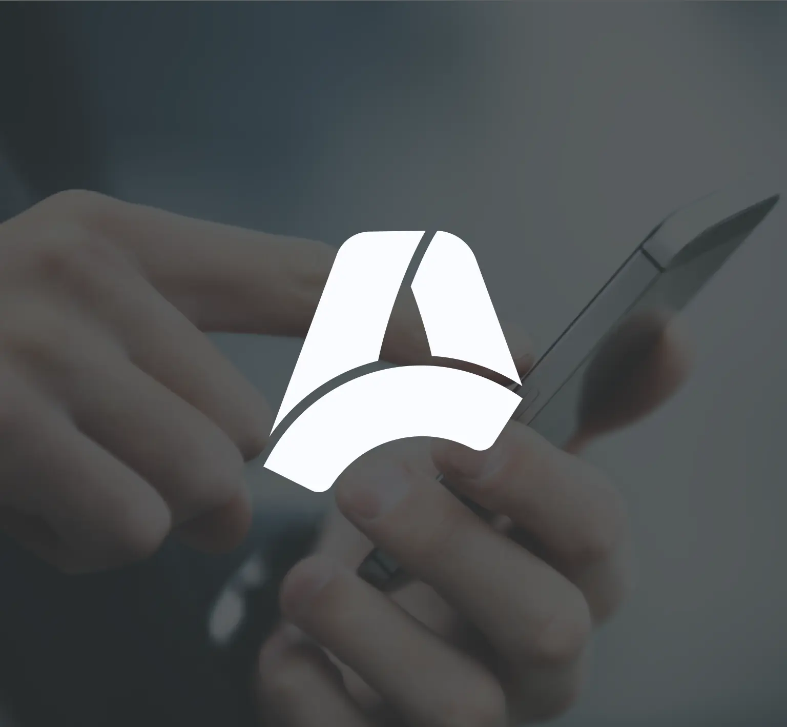 Apkudo logo over someone using a phone